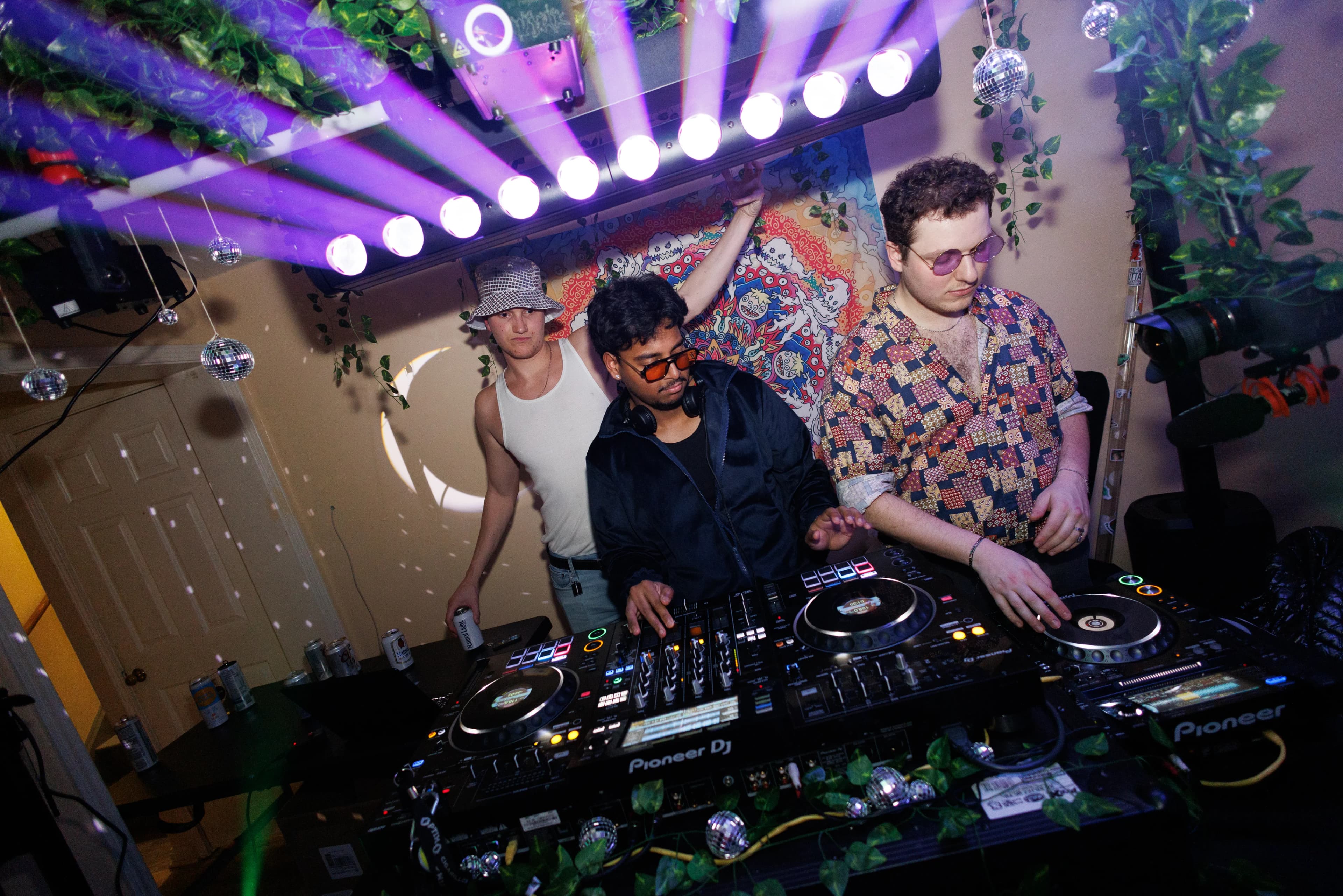 At the decks under a row of moving lights